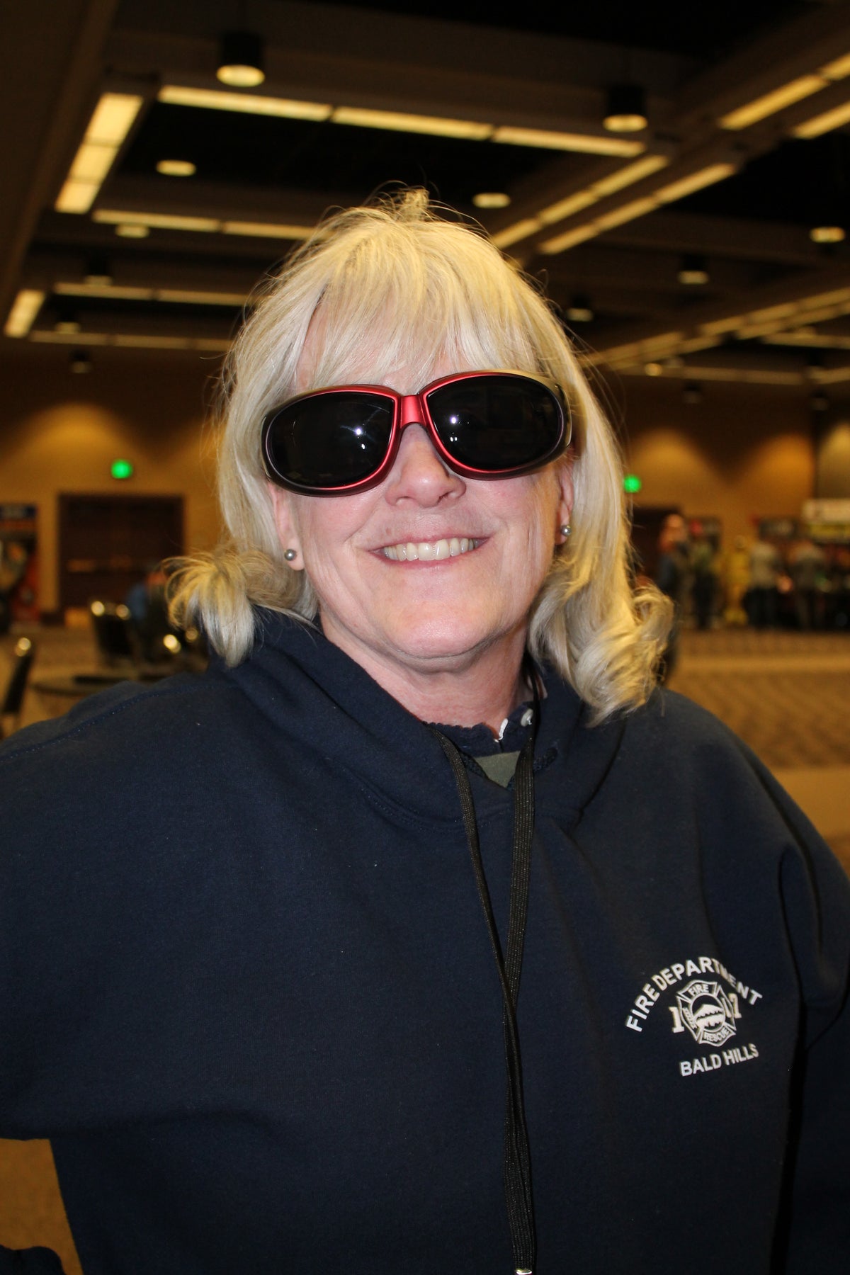 Woman wearing black and red Kachess over-the-glasses eyewear.